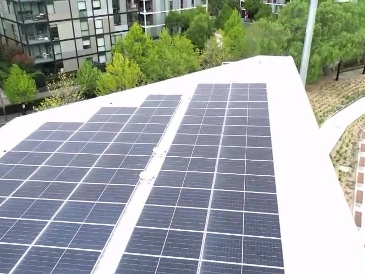 Aerial view of a commercial rooftop solar array